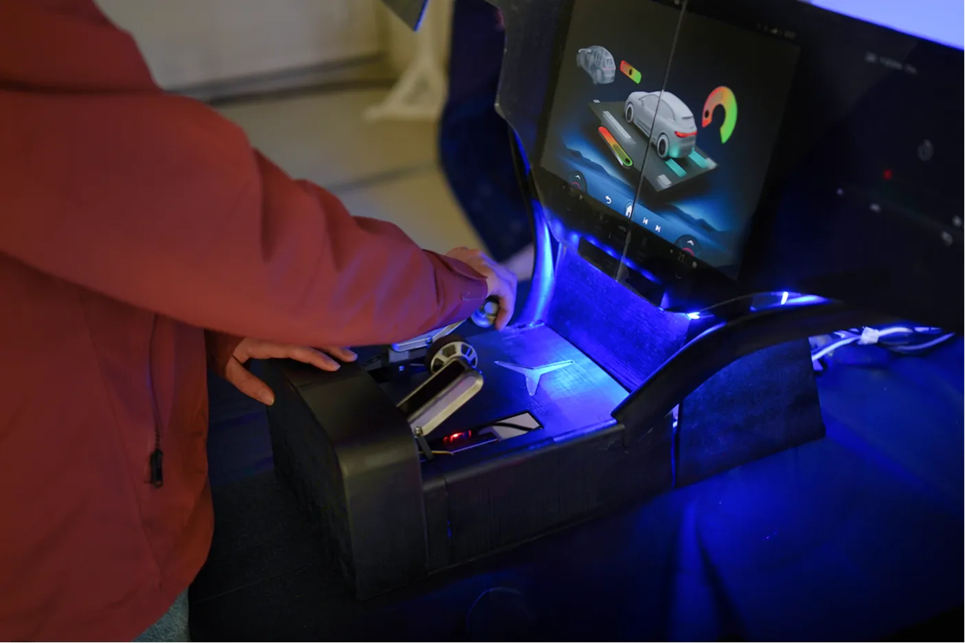 A visitor at the final presentation reaching for Glide's tangible controls, the built prototype in use.